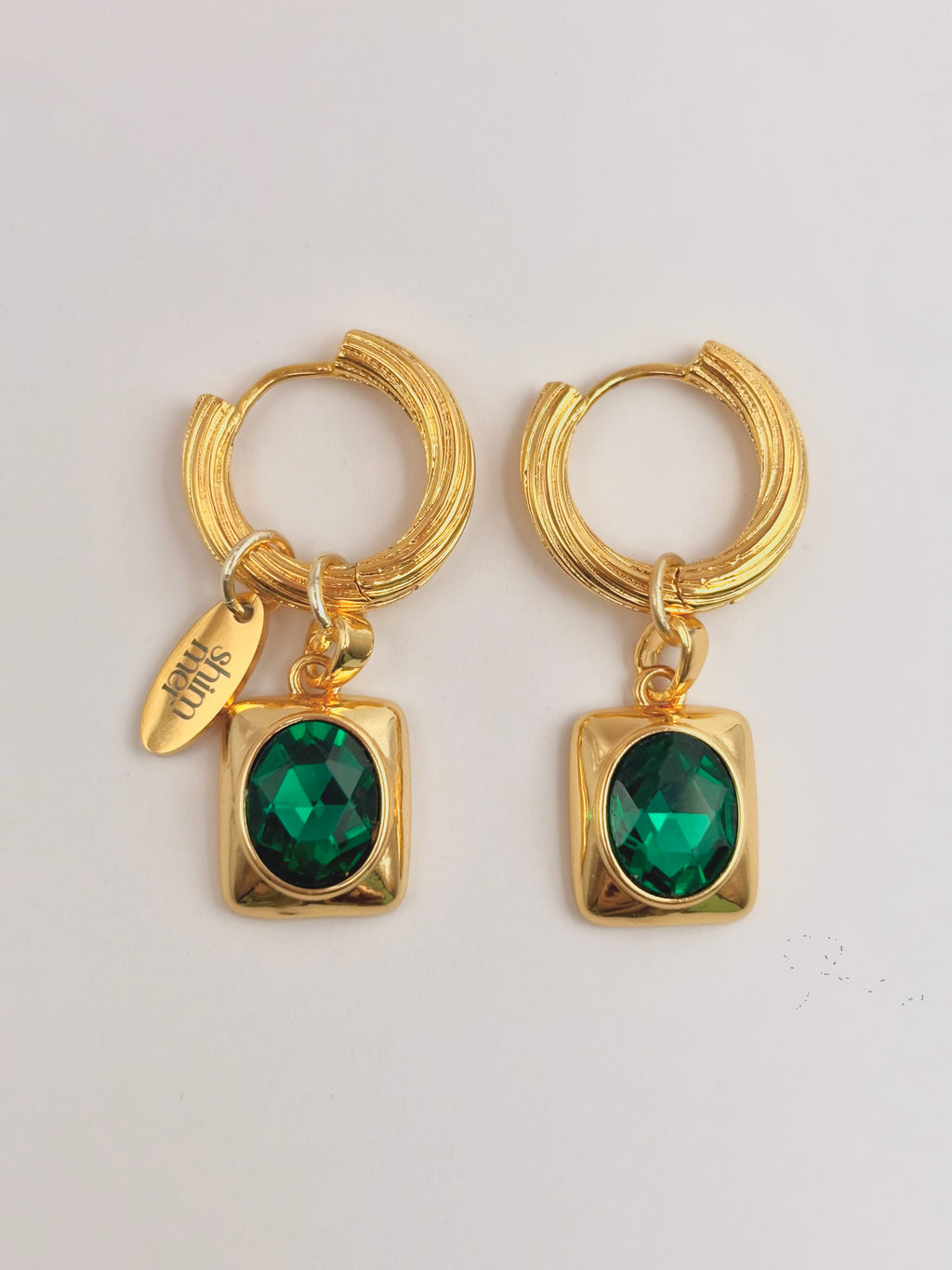 Oval Emerald golden hoop earrings